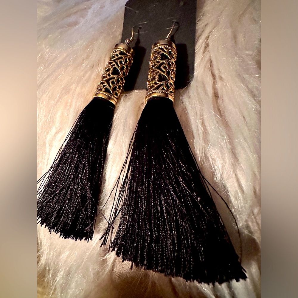 Tassel earrings, will gold colour accents.